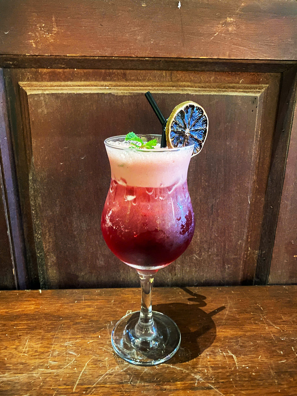 Signature cocktail and dining detail at Little Faifo