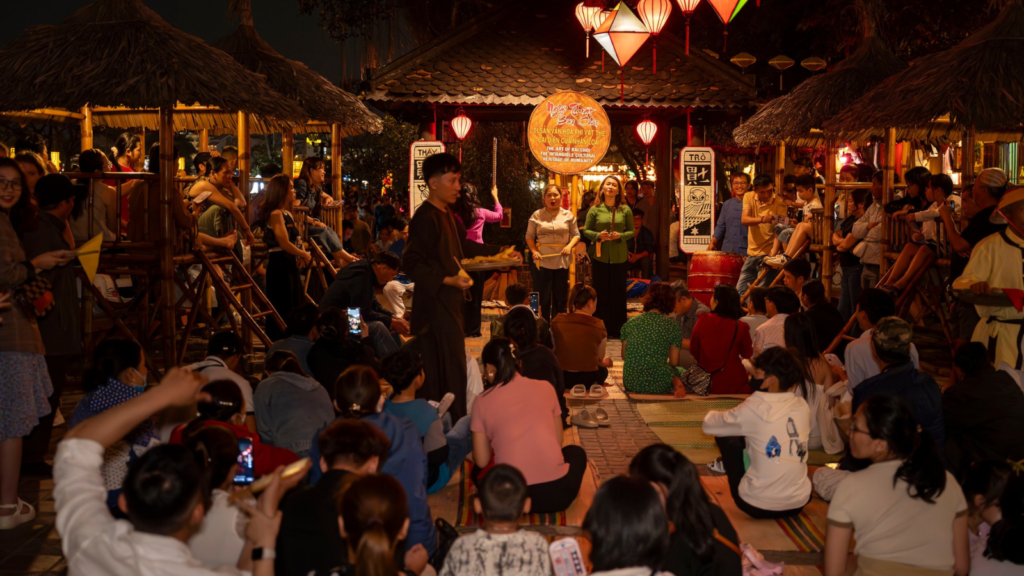 Visitors enjoying activities at Hoi An Night Market.