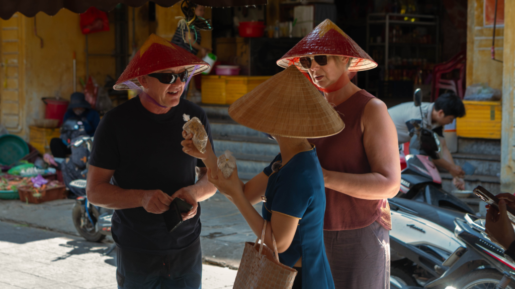 Visitors exploring and shopping at Hoi An Market.