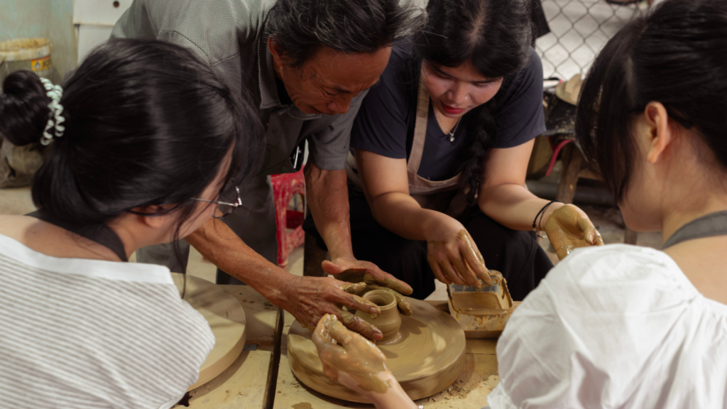 Making pottery with an artisan in Thanh Ha Village