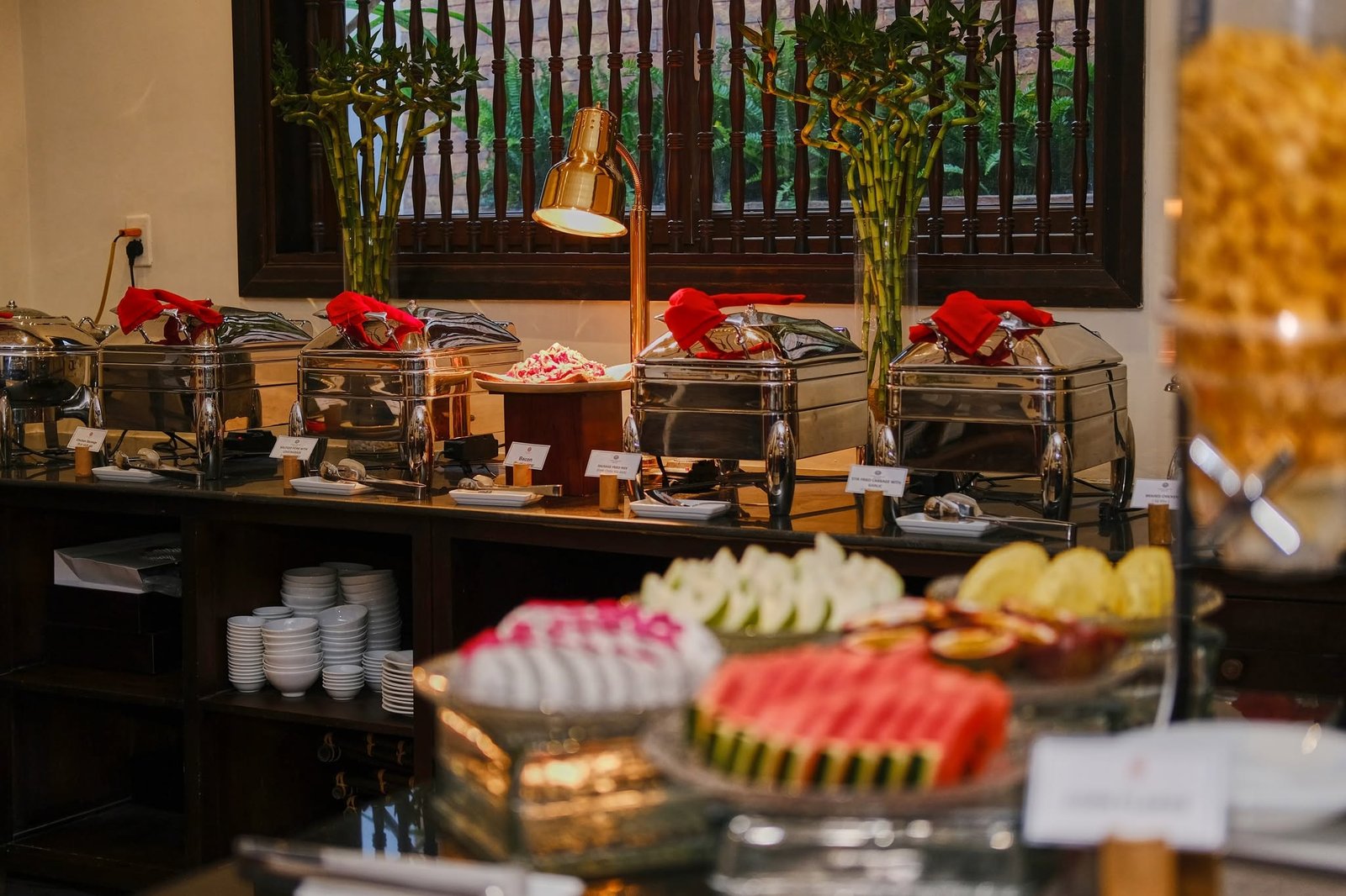 Breakfast buffet with hot dishes and fresh fruit at Little Hoi An