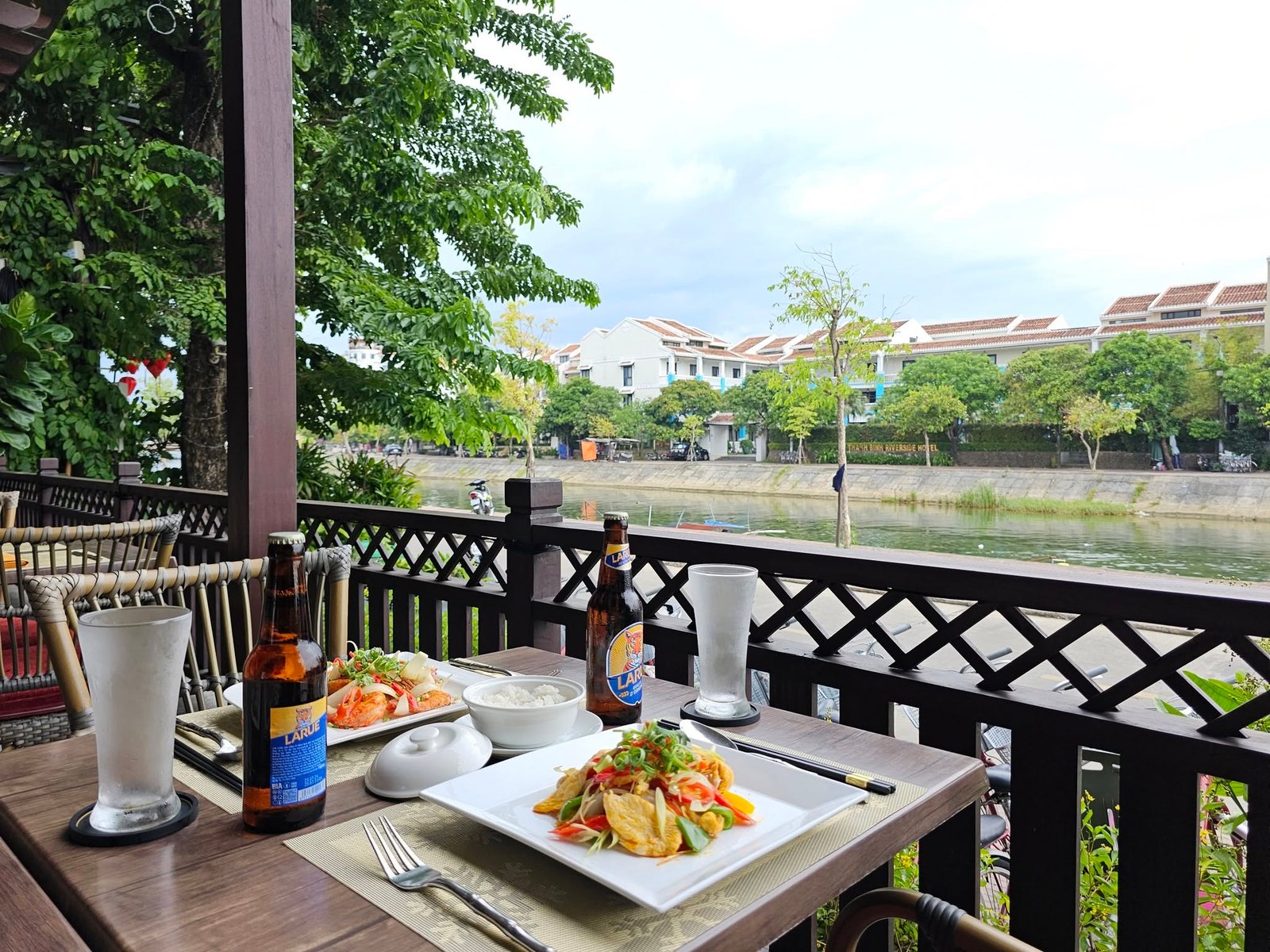 Vietnamese dishes served on the riverside terrace at Little Hoi An