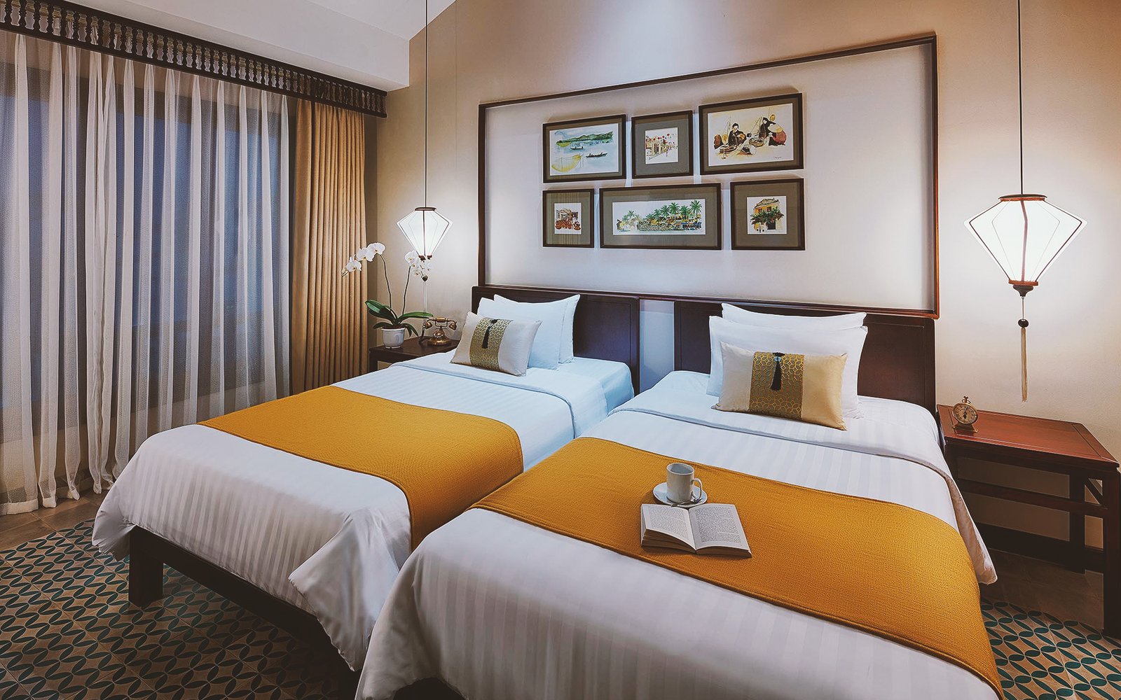 Little Deluxe twin room with lantern lights and Hoi An artwork