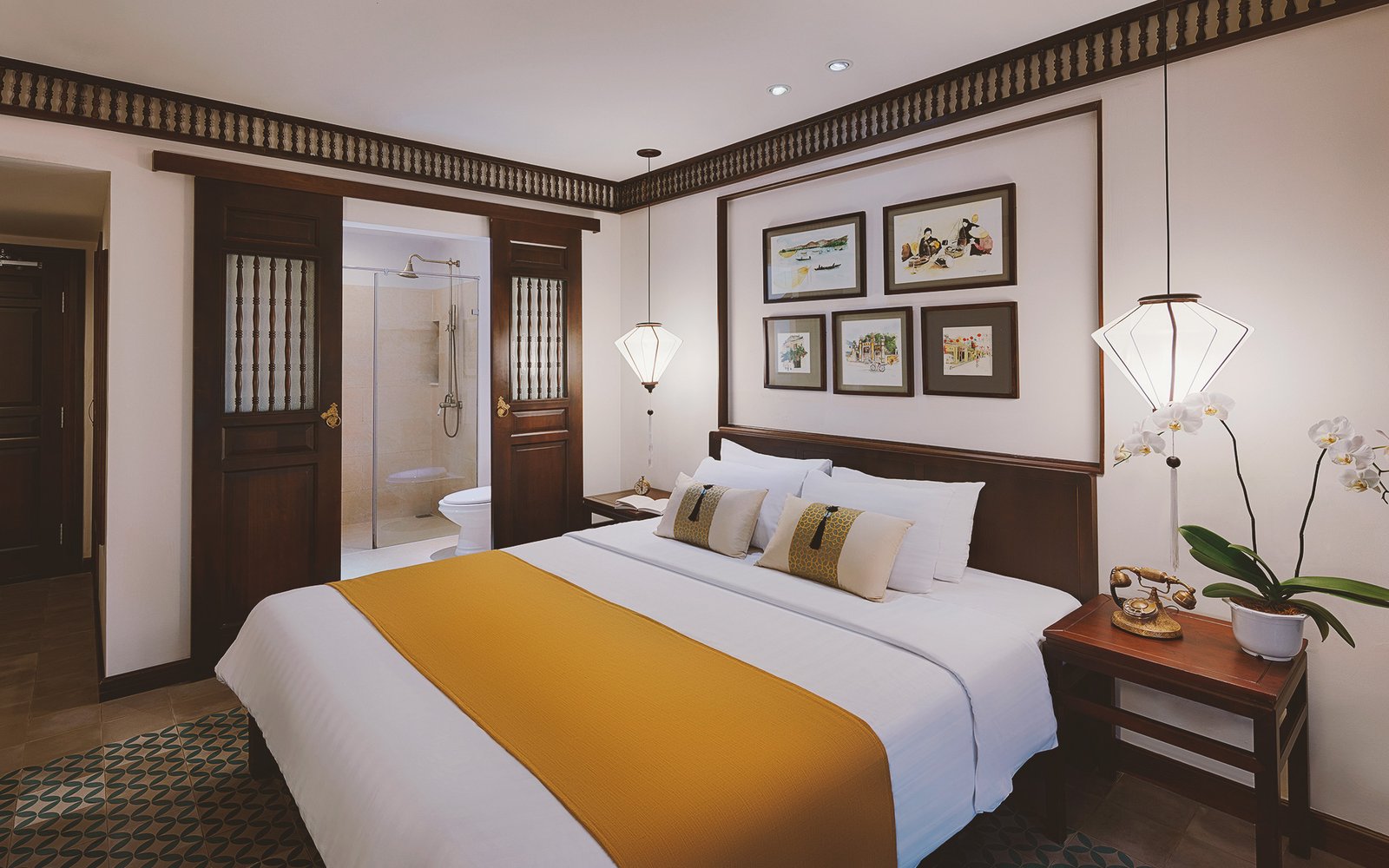 Little Suite king room with heritage wood details at Little Hoi An