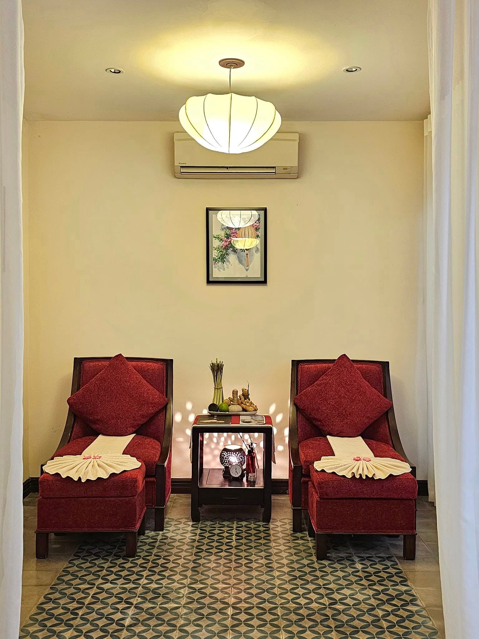 Spa relaxation loungers prepared with towels and aromatherapy herbs