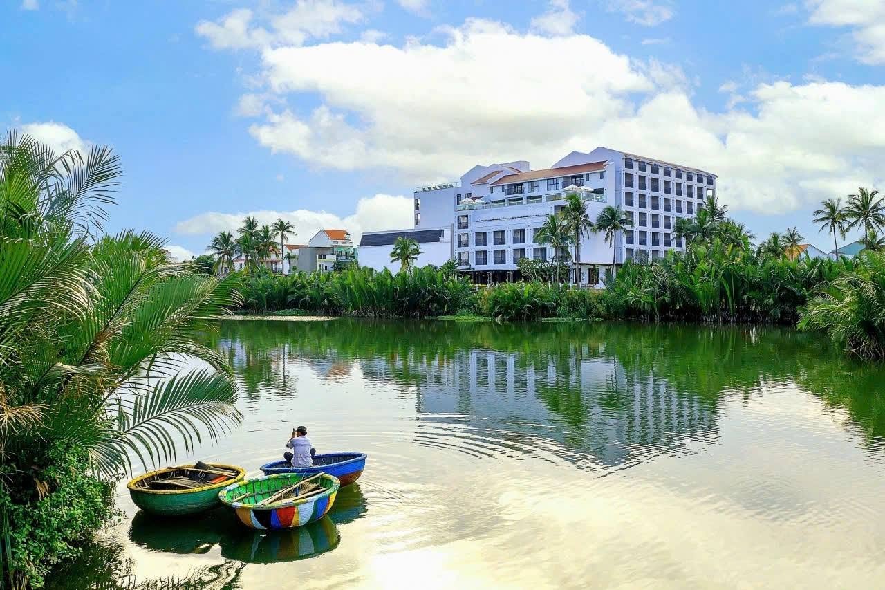 Little Oasis Hoi An beside the river with traditional basket boats