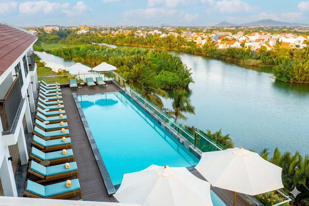 Rooftop infinity pool overlooking the river at Little Oasis Hoi An