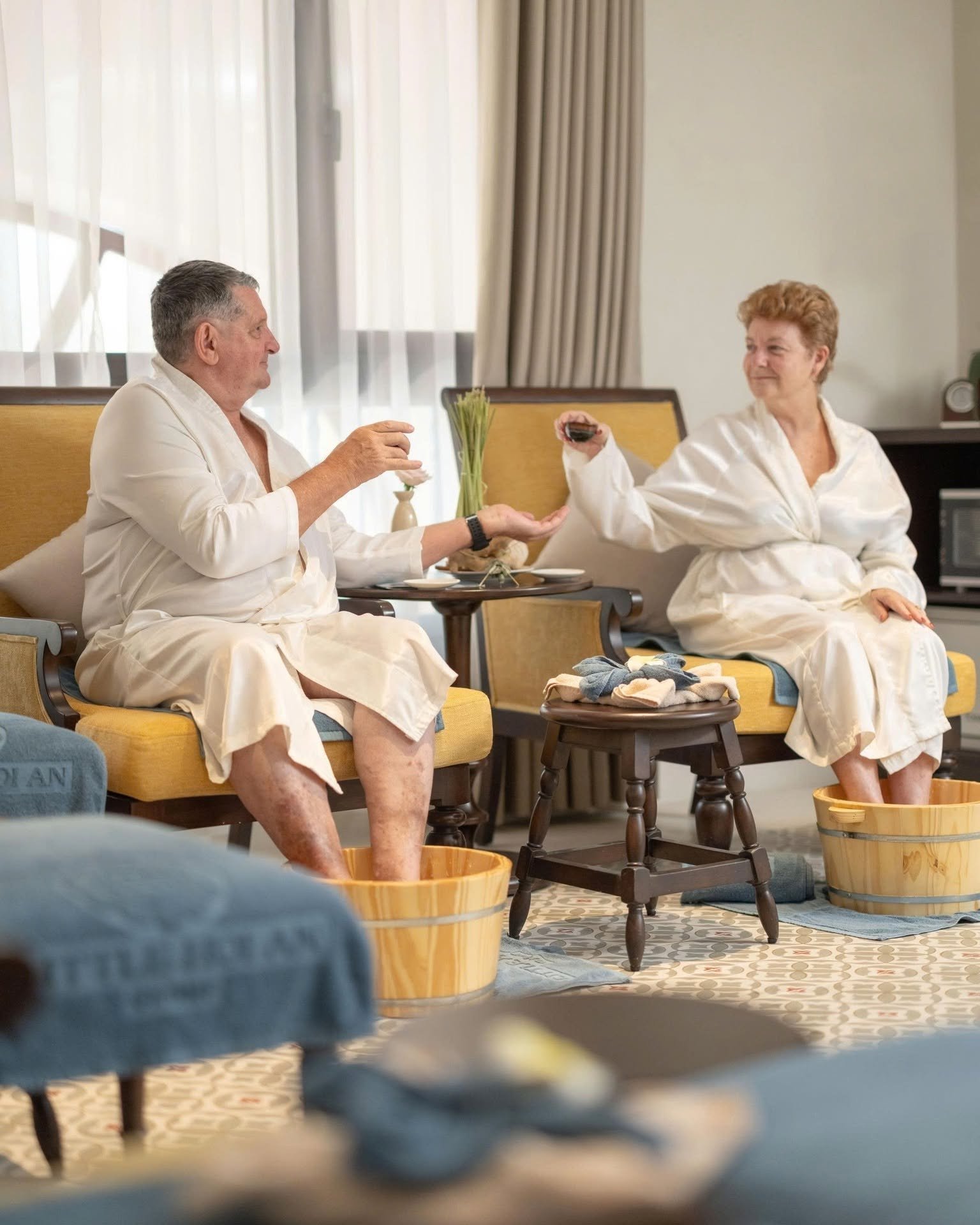 Couple enjoying a relaxing foot soak ritual at Little Residence Spa