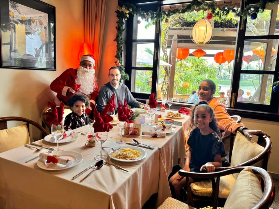 Family enjoying a Christmas dining celebration at Little Riverside