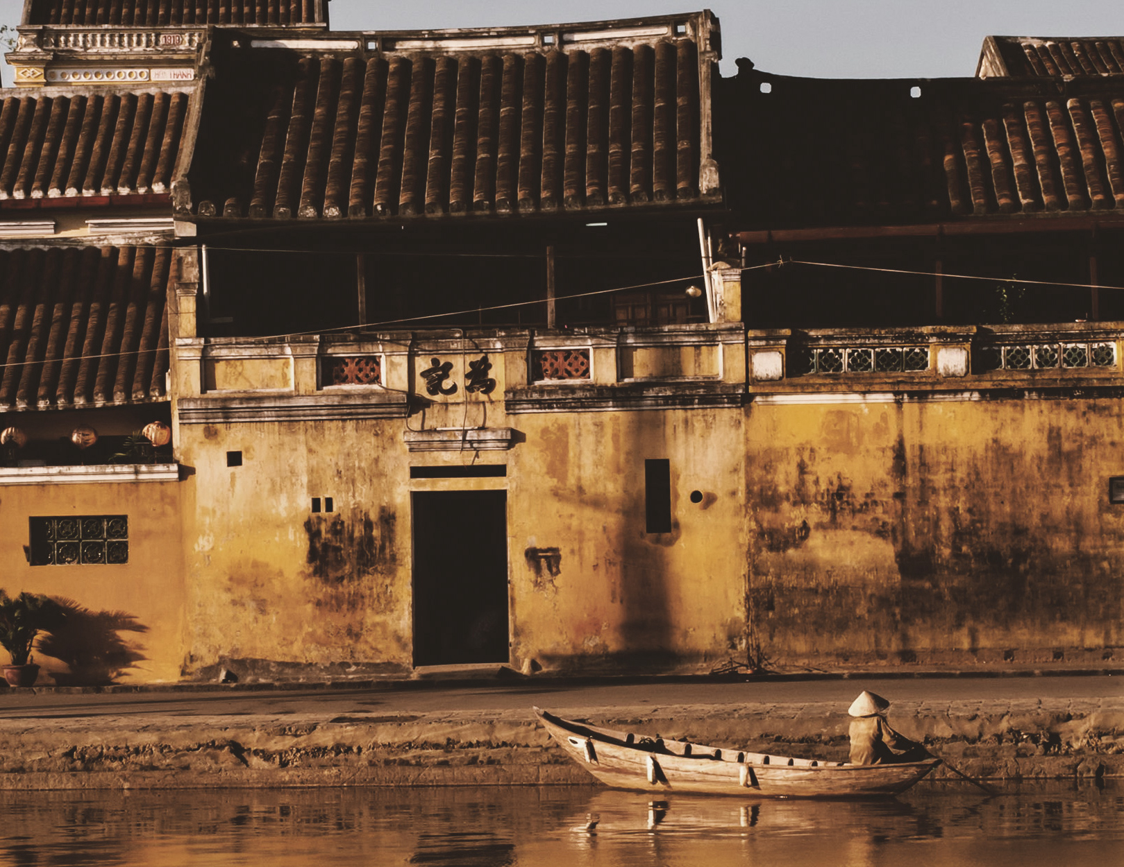 Hoi An ancient town roofs and warm evening light