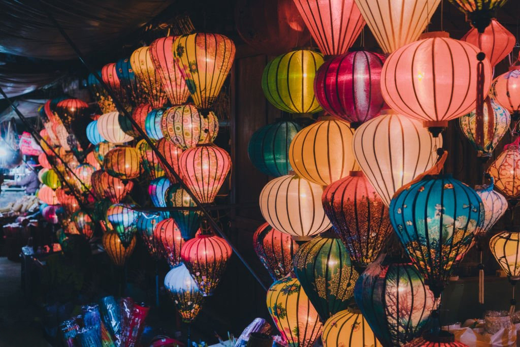 Lanterns glowing above a Hoi An street